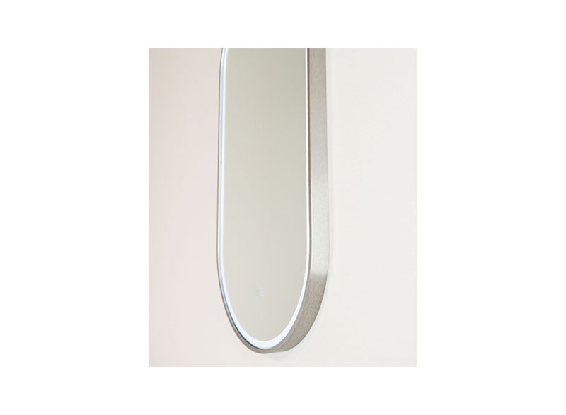 and the backlit aura of light that it emits gives the mirror a sense of exclusivity. With the practical luxury of an in-built demister that defogs the mirror after a hot shower